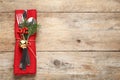 Cutlery set on wooden table, top view. Christmas celebration Royalty Free Stock Photo