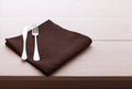 Cutlery, tablecloth on white wooden table for