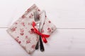 Cutlery, tablecloth on white wooden table for