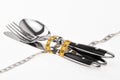 Cutlery wrapped with a tape measure, symbol for a diet Royalty Free Stock Photo