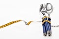Cutlery wrapped with a tape measure, symbol for a diet Royalty Free Stock Photo