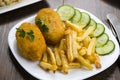 Cutlet de volaille with fries Royalty Free Stock Photo