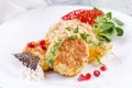 Cutlet in Kiev with garnish of brown rice. Close-up.