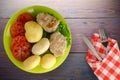 Cutlet with potatoes on lime plate top view Royalty Free Stock Photo