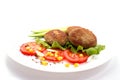 Cutlets breaded with herbs tomatoes Royalty Free Stock Photo
