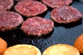 Cutlets and burger buns fried in a pan, street food Royalty Free Stock Photo