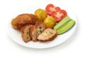 Cutlets cordon bleu with potatoes, tomatoes and cucumbers, isolated on white background Royalty Free Stock Photo