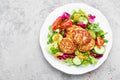 Cutlets and fresh vegetable salad on white plate. Fried meatballs with vegetable salad Royalty Free Stock Photo