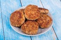 cutlets on a grey plate, on a blue wooden background Royalty Free Stock Photo