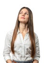 Cutout businesswoman stands with folded arms looking up