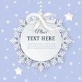 Cutout 3D paper circle frame label with silver satin bow and snowflakes on the light purple background. Royalty Free Stock Photo