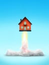 Cut-out object shot of a house rocket launch isolated on a blue background Royalty Free Stock Photo