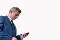 Cutout of Mature attractive businessman using smartphone