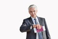 Mature businessman checking time on his watch after checked in at airport Royalty Free Stock Photo