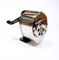 Isolated shot of a retro hand crank pencil sharpener on a white background Royalty Free Stock Photo