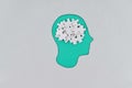 Cutout silhouette of a human cardboard head containing brain made from puzzle pieces, revealing thinking concept Royalty Free Stock Photo