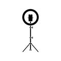 Cutout silhouette Led ring lamp on tripod with smartphone. Outline icon. Black simple illustration of light for selfie, blogger.