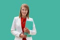 Portrait of young attractive businesswoman standing while holding document Royalty Free Stock Photo