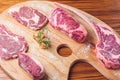 Cuts of raw steak premium on rustic wooden table. Fresh and raw meat. Raw meat mixture. Raw beef steaks on wooden table