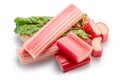 Cuts of red rhubarb on green rhubarb leaf on white background. File contains clipping path Royalty Free Stock Photo