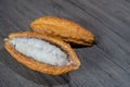 Cutted cocoa pod with beans inside. Fresh cacao at plantation Royalty Free Stock Photo