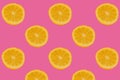 Cutted fresh lemons on bright pink background
