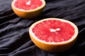 Cutted grapefruit on a dark background Royalty Free Stock Photo