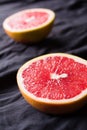 Cutted grapefruit on a dark background Royalty Free Stock Photo