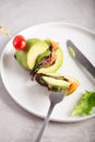 Cutted organic raw avocado burger with salted salmon and fresh vegetables Royalty Free Stock Photo