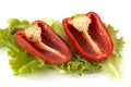 Cutted sweet red pepper on salad leaves Royalty Free Stock Photo