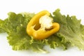 Cutted sweet yellow pepper on salad leaves Royalty Free Stock Photo