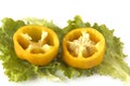 Cutted sweet yellow pepper on salad leaves Royalty Free Stock Photo