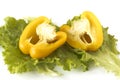 Cutted sweet yellow pepper on salad leaves Royalty Free Stock Photo