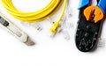 Cutter, crimper, yellow patch cord and connectors Royalty Free Stock Photo