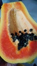 Sliced fresh red papaya fruit with seeds. Royalty Free Stock Photo