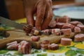 Cutting bacon into large pieces