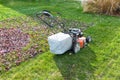 Cutting and bagging grass and leaves in the fall Royalty Free Stock Photo