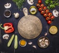 Cutting board, around lie ingredients variety of vegetables and fruits, place for text,frame wooden rustic background top view Royalty Free Stock Photo