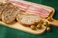 Cutting board with bacon and bread Royalty Free Stock Photo