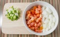 Cutting Board with Chopped Tomatoes, Onions and Spring Onions Royalty Free Stock Photo