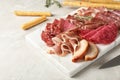 Cutting board with different meat delicacies Royalty Free Stock Photo