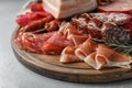 Cutting board with different meat delicacies Royalty Free Stock Photo