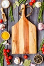 Cutting board in frame of food for chef work on wooden background top view space for text Royalty Free Stock Photo