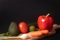 Cutting board with fresh vegetables and herbs for book covers, blogs, commercials and more about healthy cooking