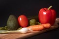 Cutting board with fresh vegetables and herbs for book covers, blogs, commercials and more about healthy cooking