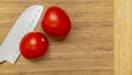 cutting board with a knife and tomato Royalty Free Stock Photo