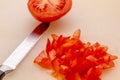 cutting board with a knife and tomato  on a white background Royalty Free Stock Photo