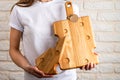 Cutting board made of light wood with cheese-like holes