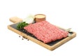 Cutting board with minced meat and spices isolated on background Royalty Free Stock Photo