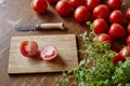 Cutting board scene with tomatoes
